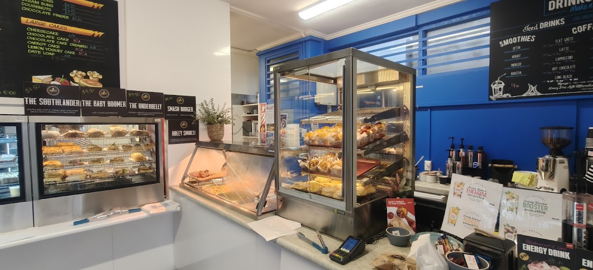 Inside Make n Bake, the food cabinet and menu boards