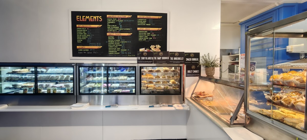 The Make n Bake counter with cabinets and the Elements menu board